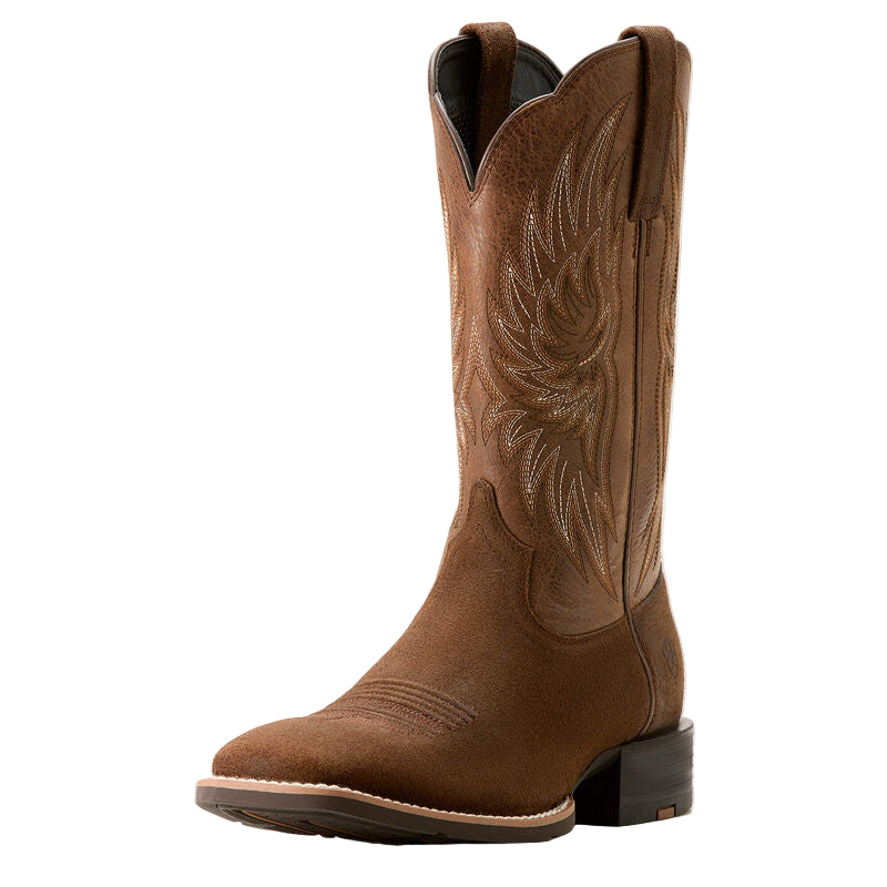Brown cowboy boot with intricate designs on a white background
