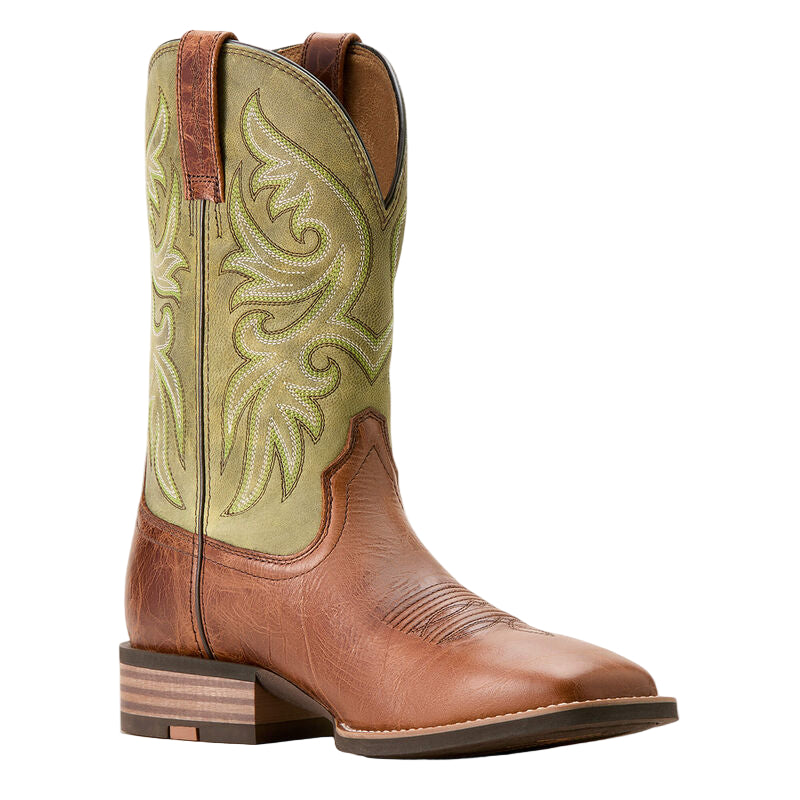 Brown and green cowboy boot with intricate embroidery on a beige background