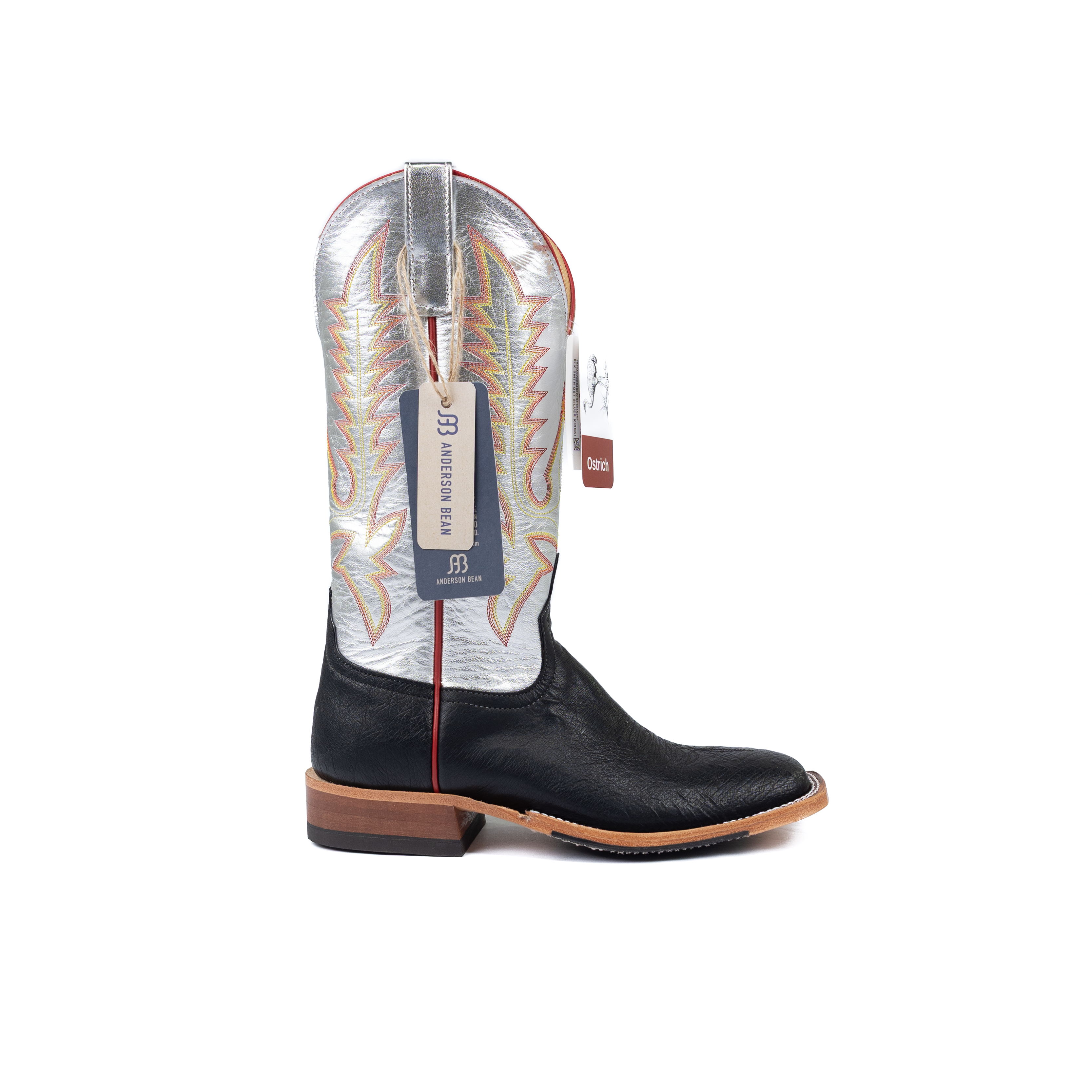 Black cowboy boot with a white insole on a white background
