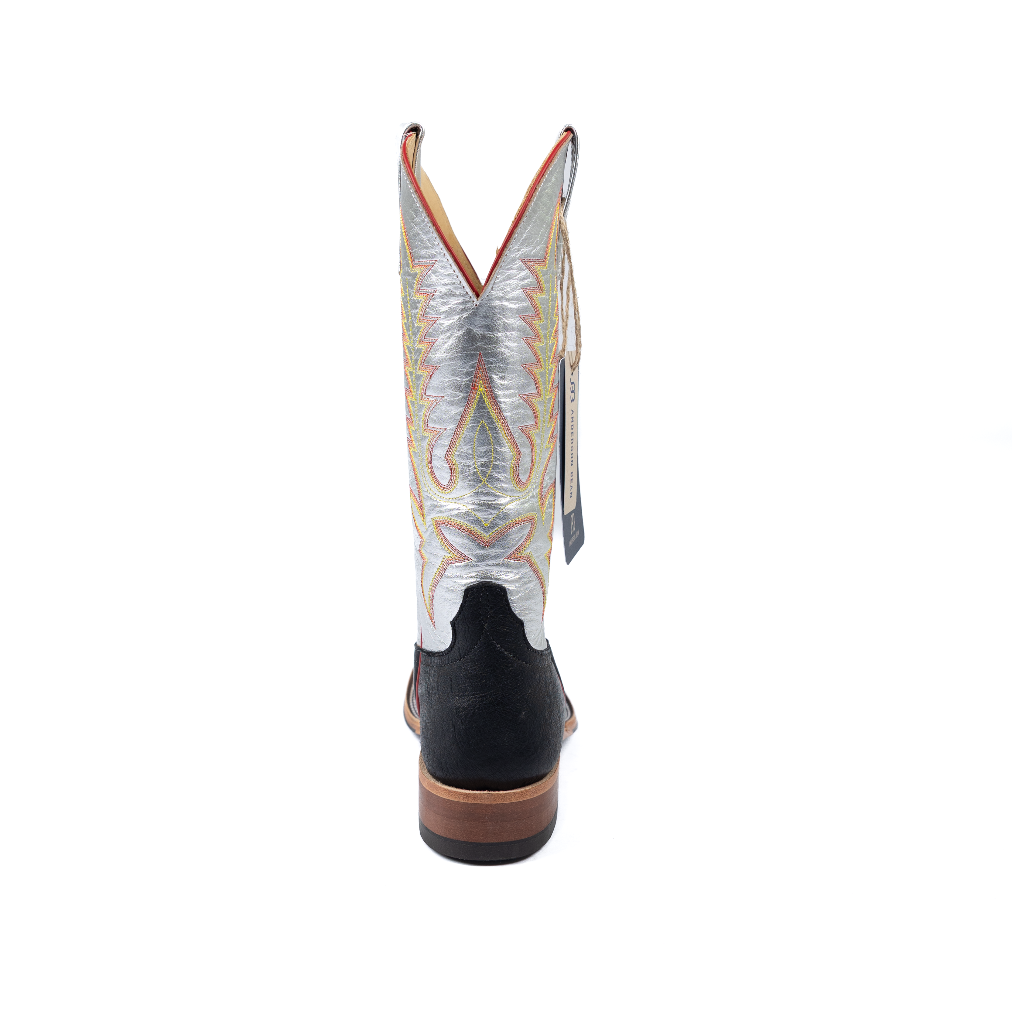 Cowboy boot with decorative pattern on a white background