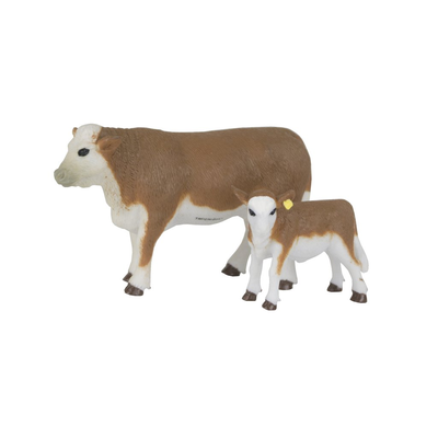 Two cow figurines on a white background
