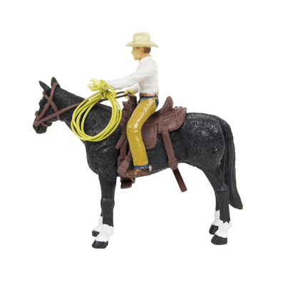 Toy figure of a cowboy on horseback with a lasso, on a white background
