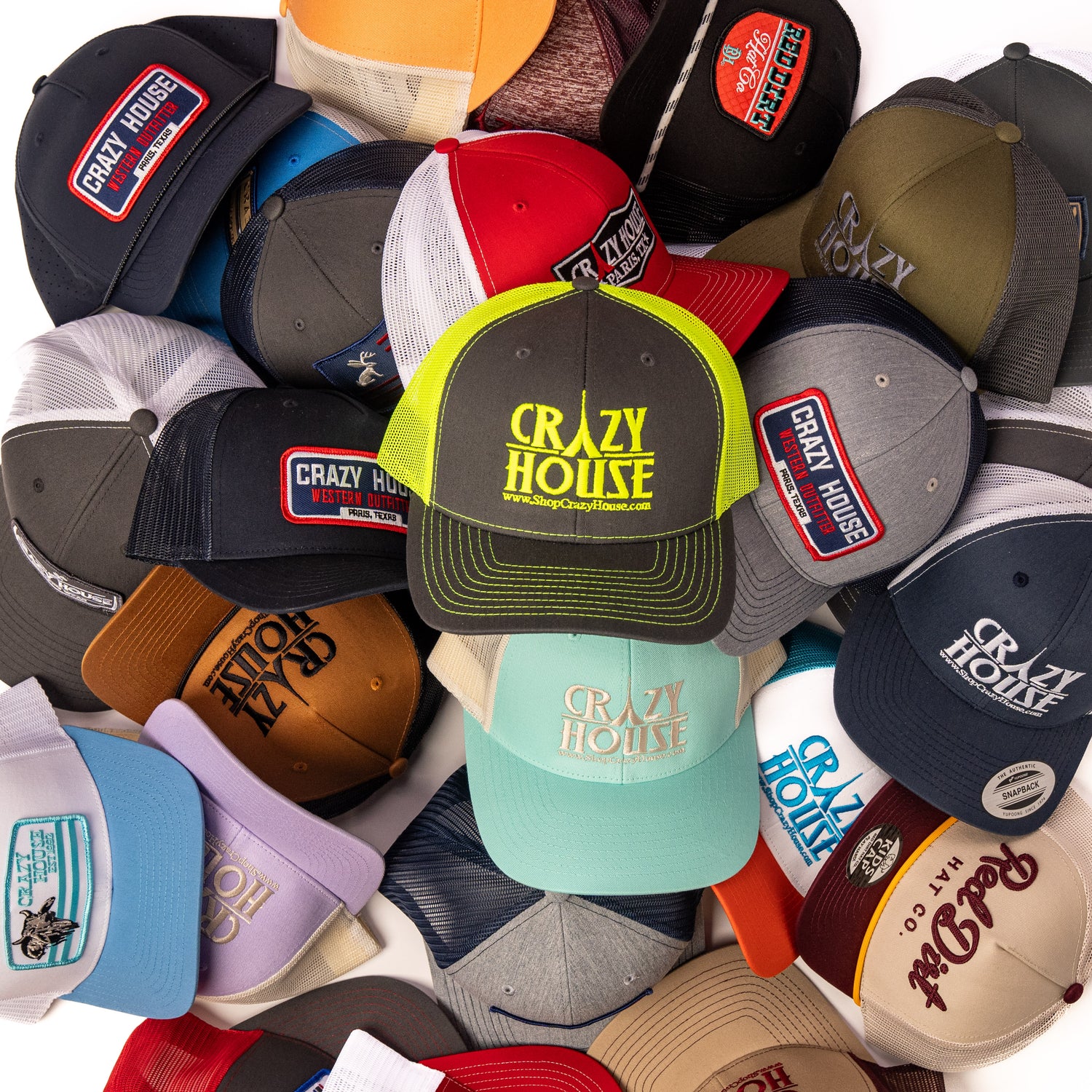 Collection of 'Crazy House' branded hats in various colors and designs.