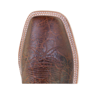 Brown leather boot sole with intricate patterns on a light gray background
