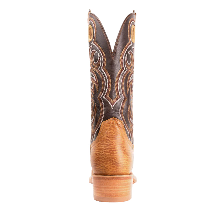 Brown cowboy boot with intricate design on a white background