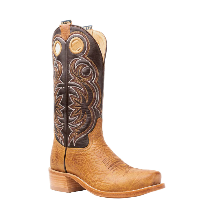 Brown cowboy boot with intricate stitching on a light gray background