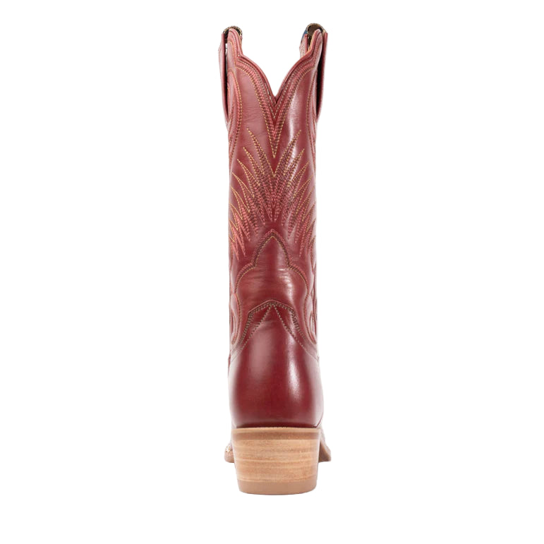 Red cowboy boot on a light gray background