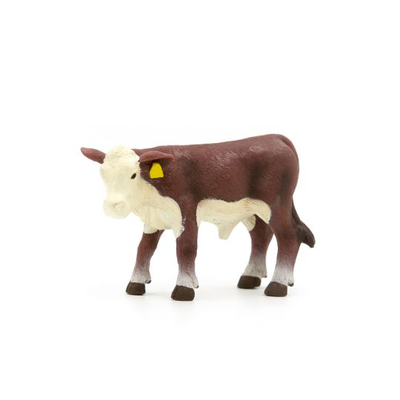 Model of a cow with a yellow tag on a white background