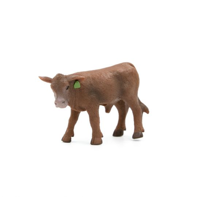 Brown cow figurine with a green tag on a white background