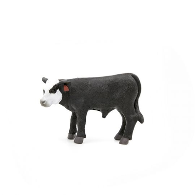 Black and white cow toy on a white background