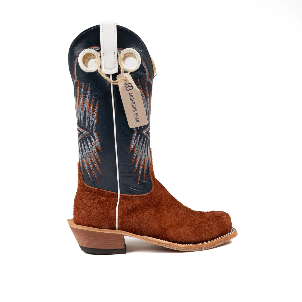 Brown cowboy boot with a black and white pattern on a white background