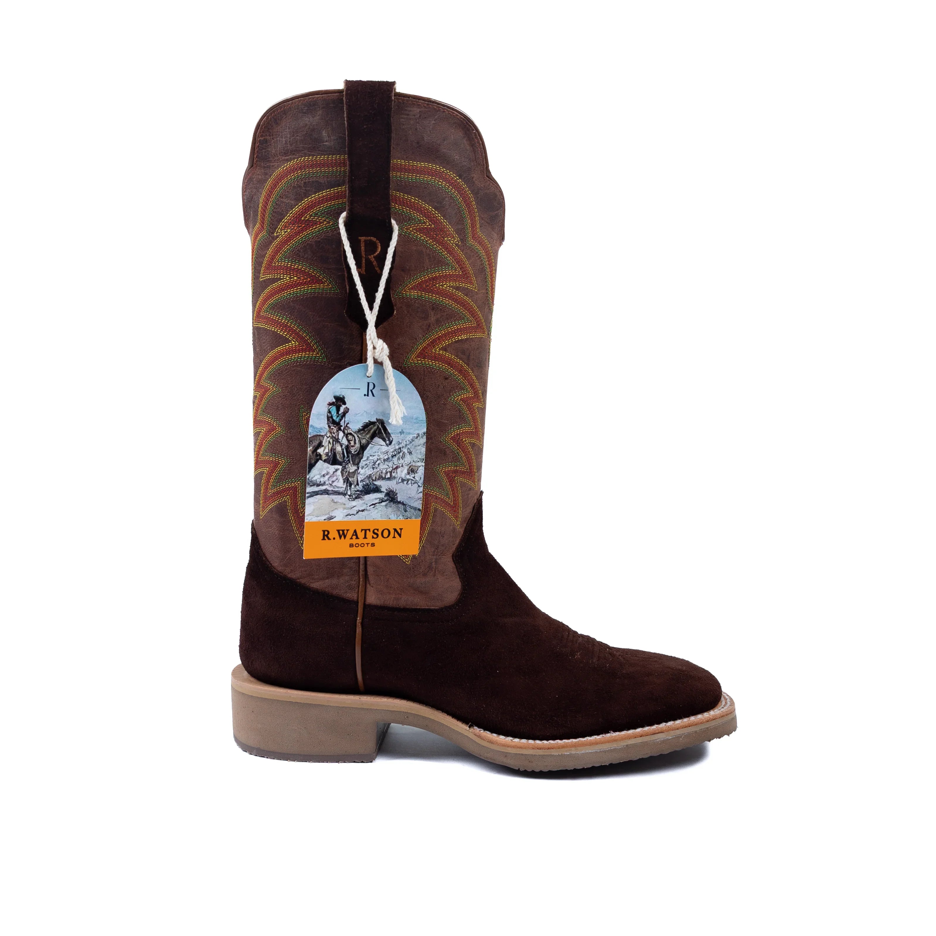 Brown cowboy boot with a brand tag on a white background