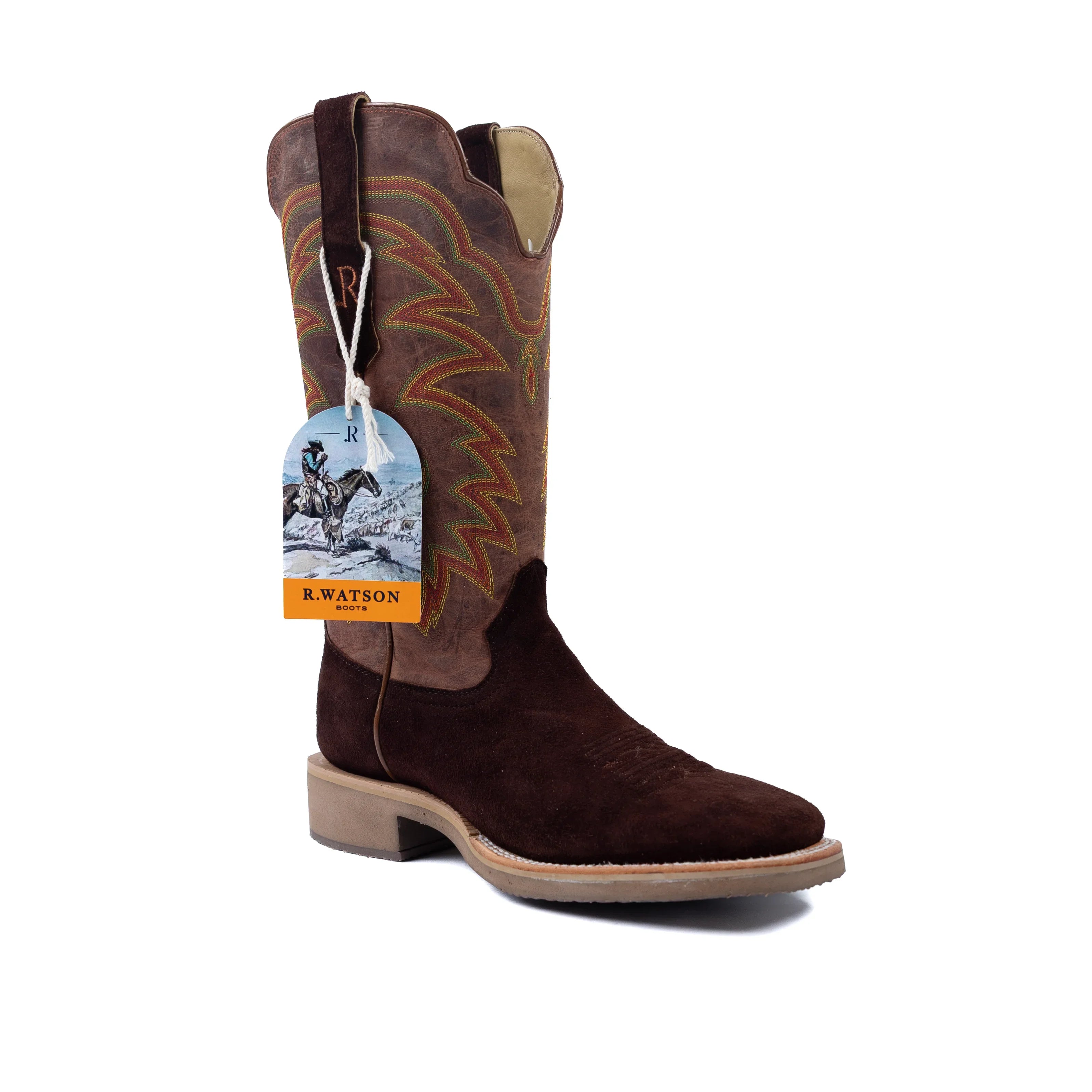 Brown cowboy boot with decorative pattern on a white background