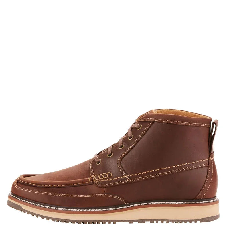 Brown leather boot with beige sole on a white background