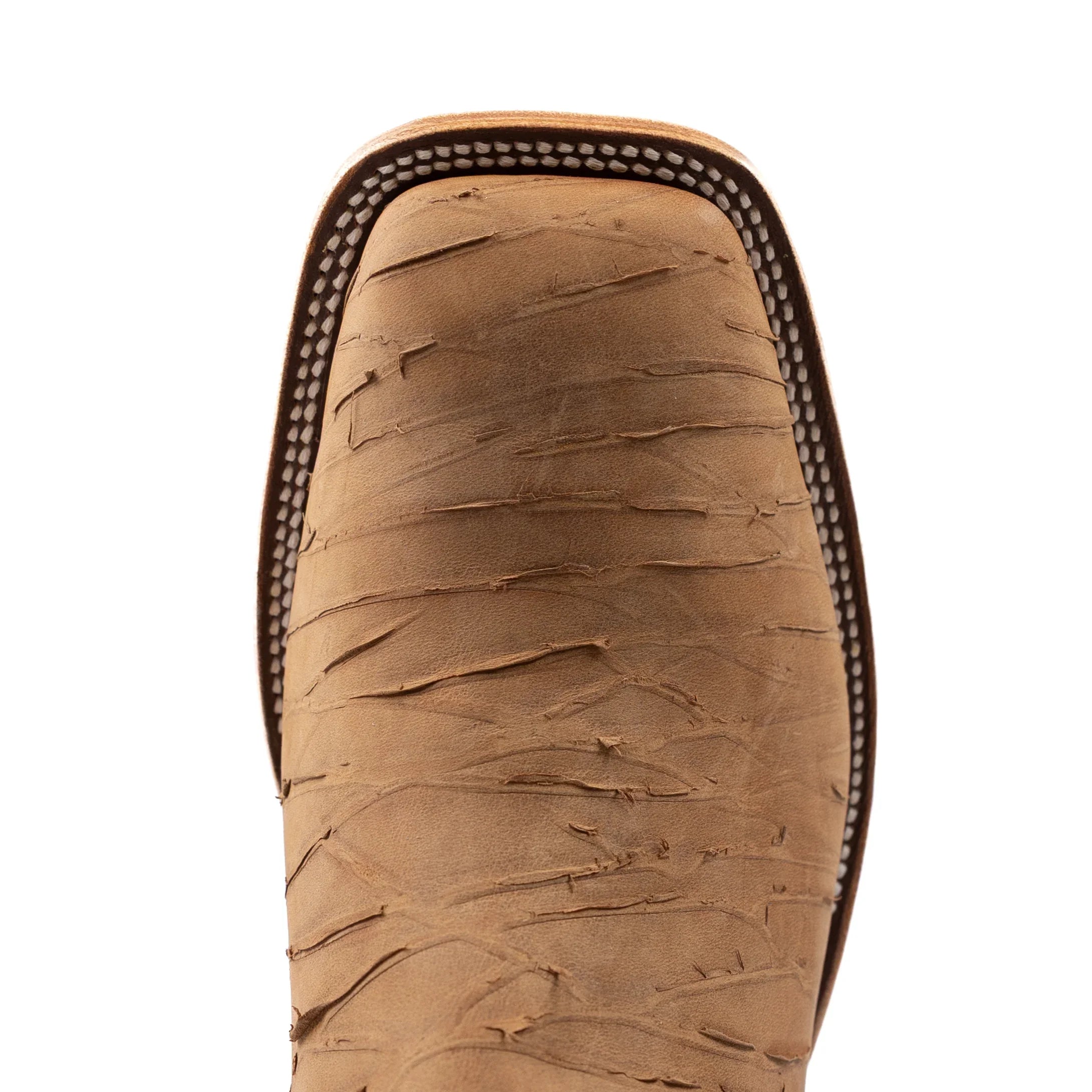 Close-up of a brown leather boot sole on a white background