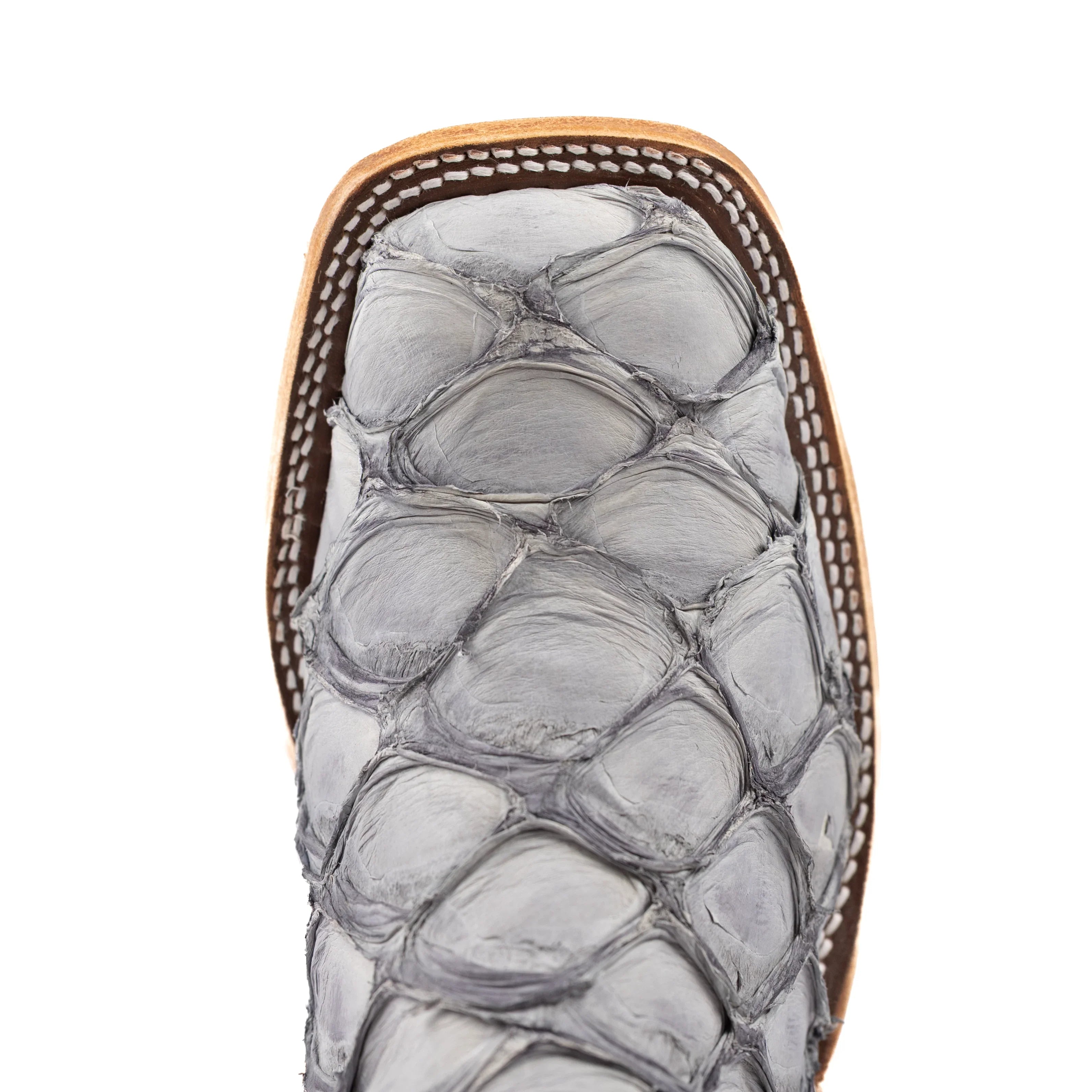 Close-up of a sandal with snake skin pattern on a white background