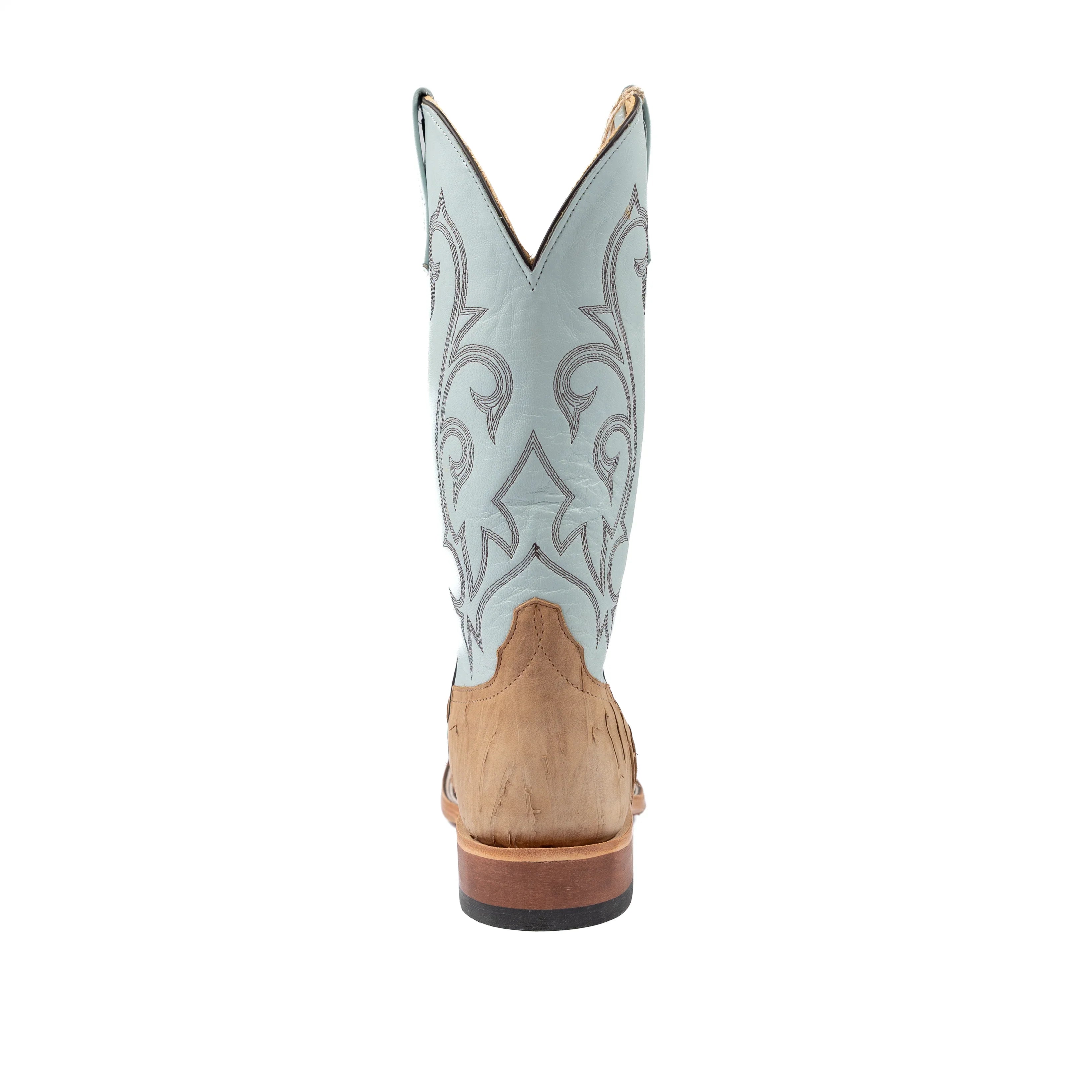 Light blue cowboy boot with brown sole on a white background