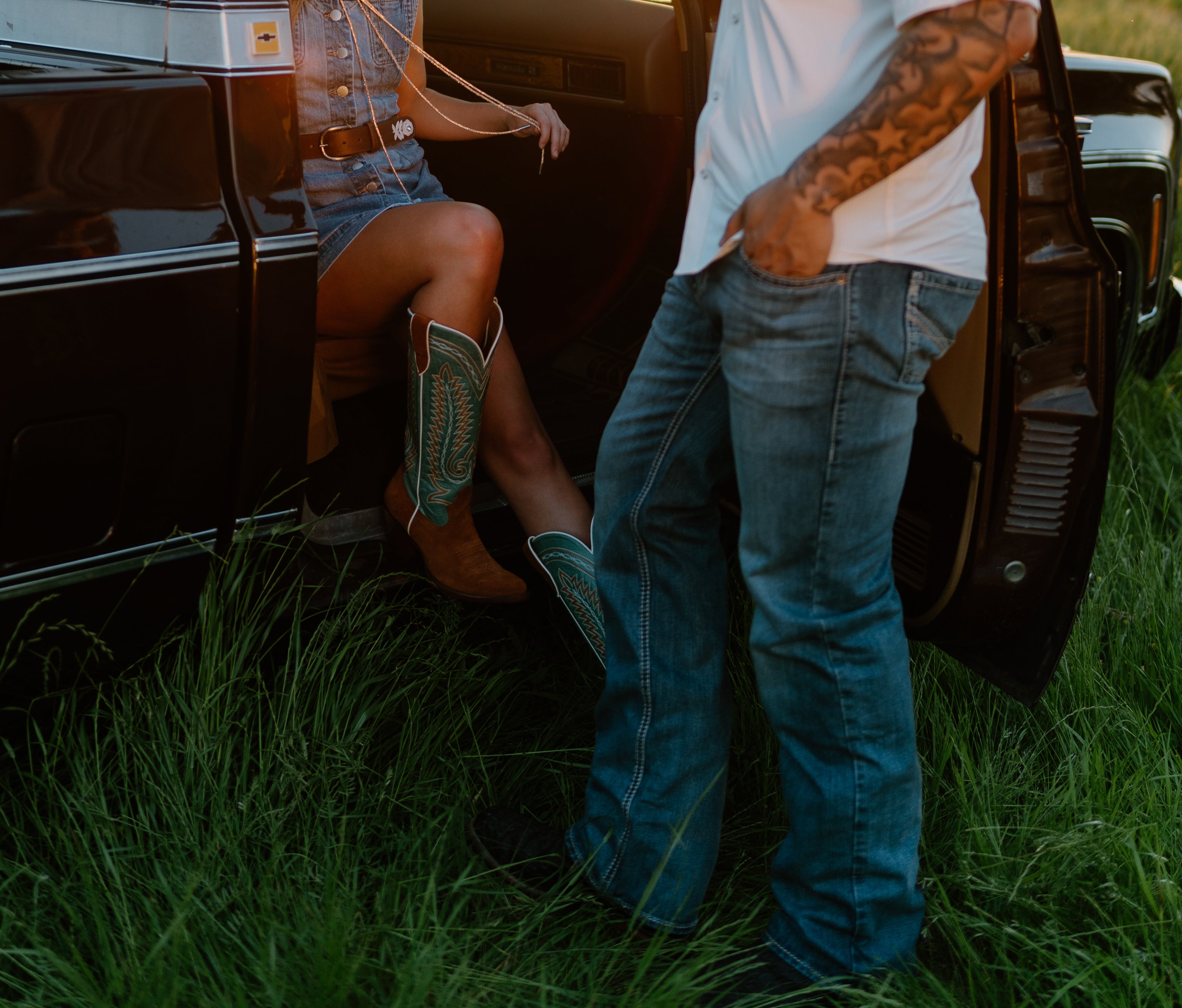 Photo of man and woman standing by a truck