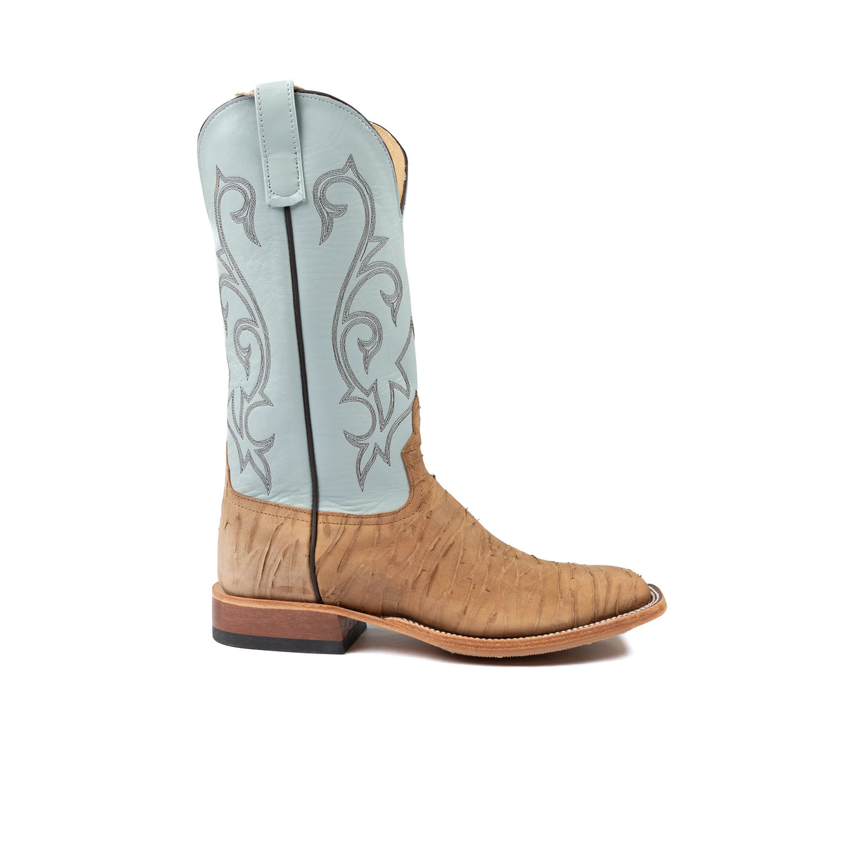 Tan cowboy boot with decorative white pattern on a white background