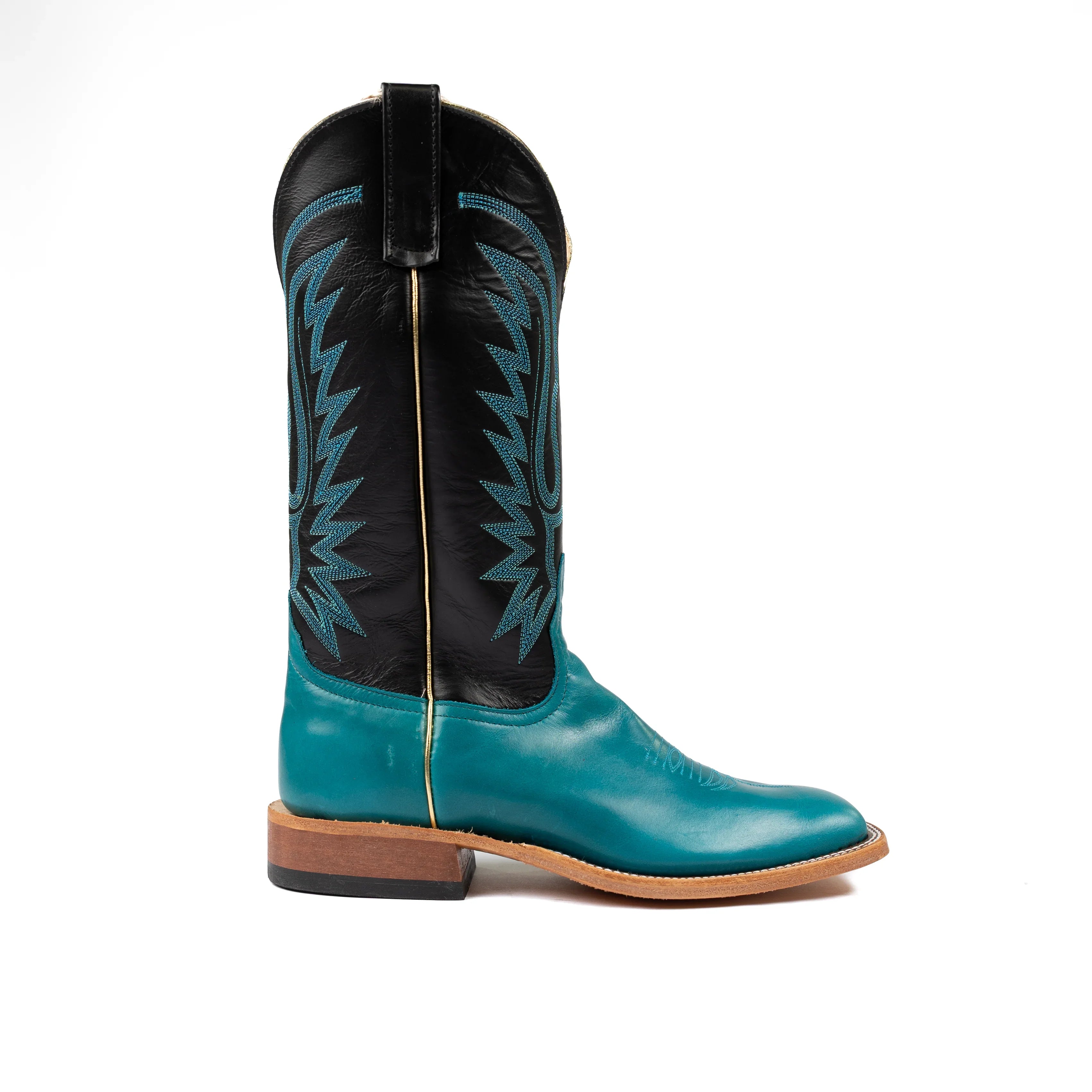 Teal and black cowboy boot on a white background