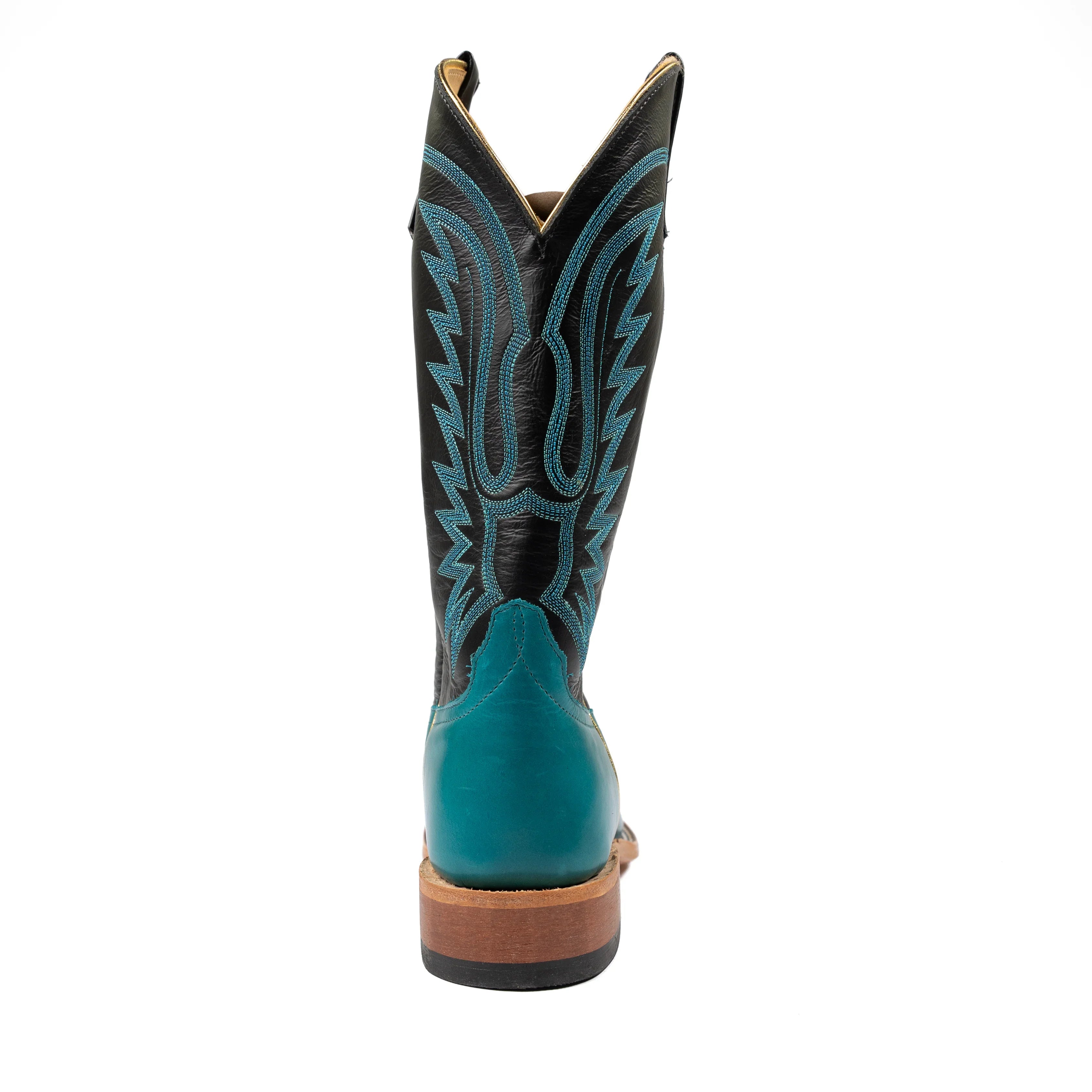 Teal and black cowboy boot on a white background