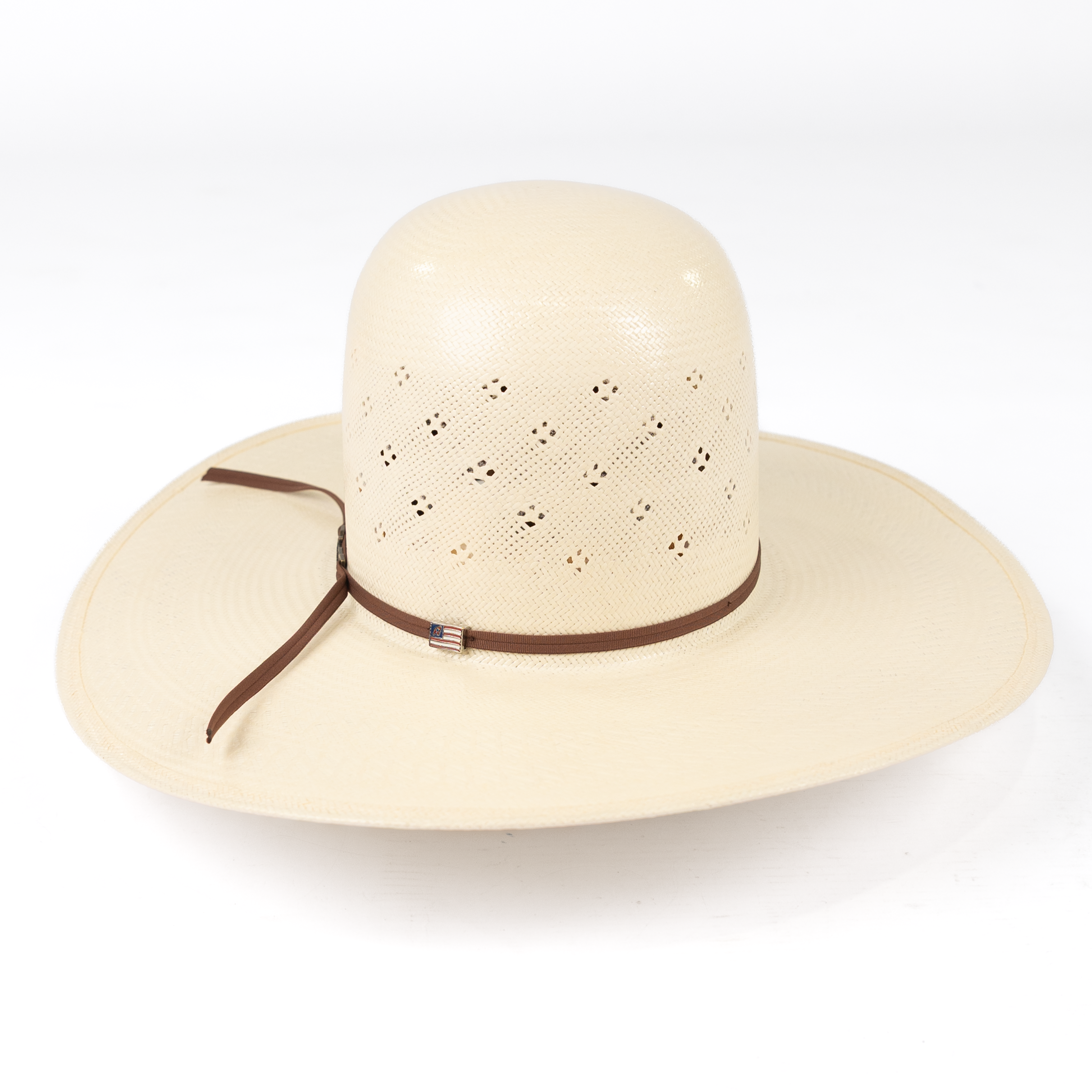 Beige sun hat with a brown ribbon on a white background