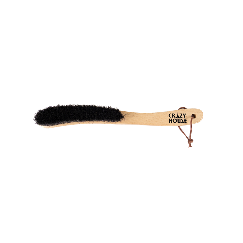 Wooden brush with black bristles on a white background, branded 'Crazy House'.