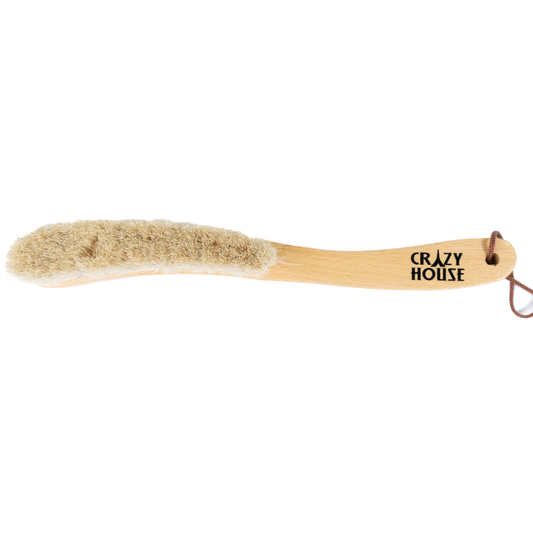 Barely used wooden brush with bristles on a white background, featuring 'Crazy House' branding.