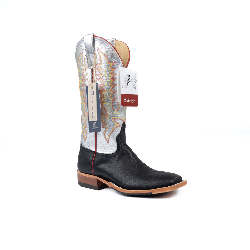 Black cowboy boot with a white insole and 'Ostrich' label on a white background
