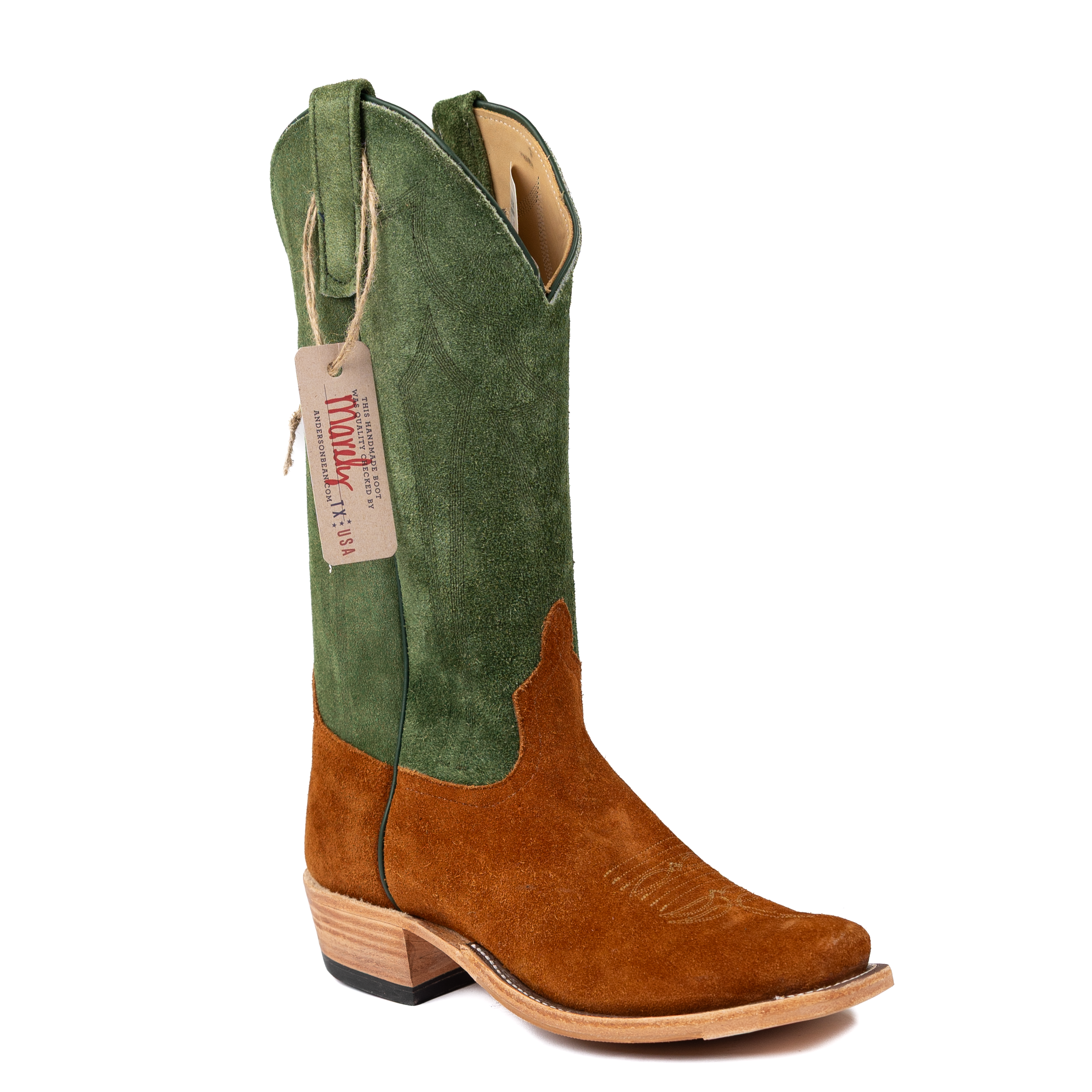 Green and brown cowboy boot with a visible brand tag on a white background