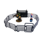 Toy set with a bull, rider, and arena on a white background