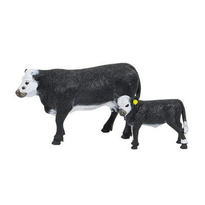 Two cow figurines on a white background