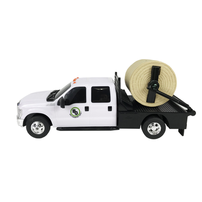 Model truck with a flatbed and hose reel on a white background