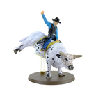Figurine of a person riding a bull on a white background