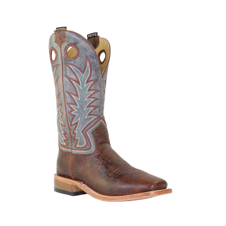 Brown cowboy boot with intricate design on a light gray background