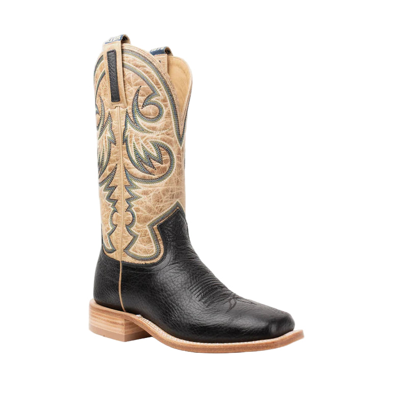 Black and tan cowboy boot on a white background