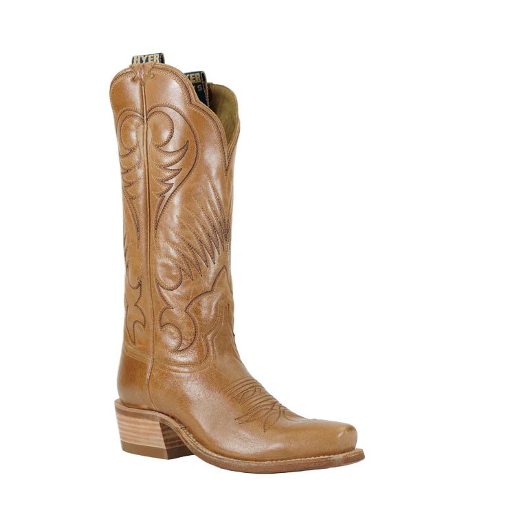 Tan cowboy boot with intricate designs on a white background