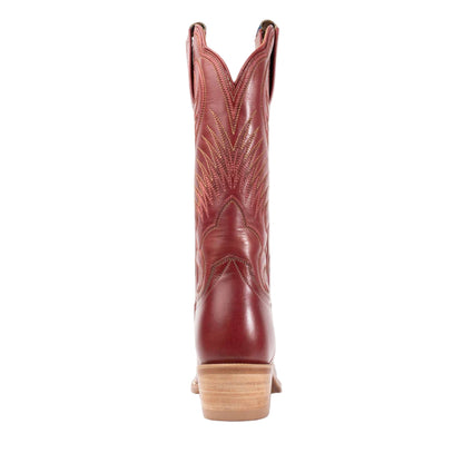 Red cowboy boot on a light gray background