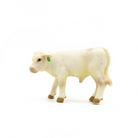 White cow figurine on a white background