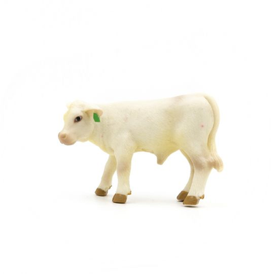 White cow figurine on a white background