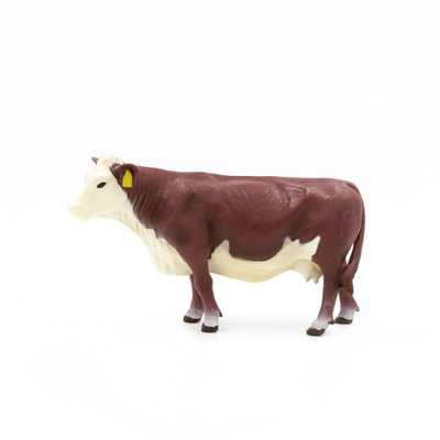 Model of a cow on a white background