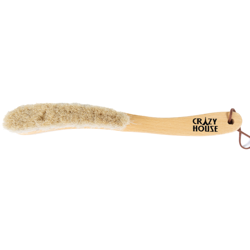 Barely used wooden brush with bristles on a white background, featuring 'Crazy House' branding.