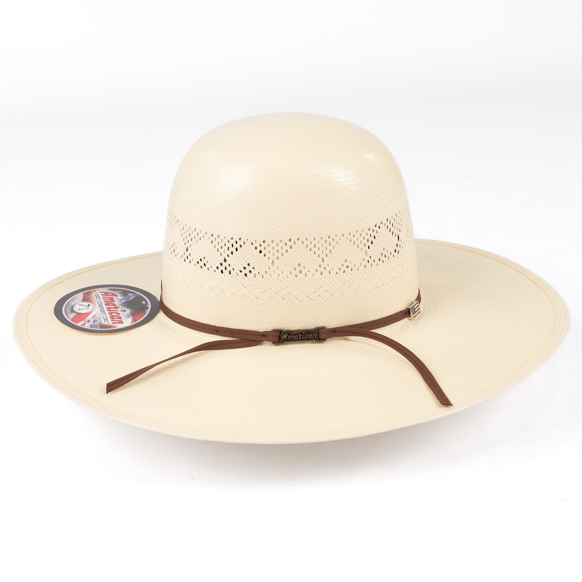Beige sun hat with a brown band on a white background