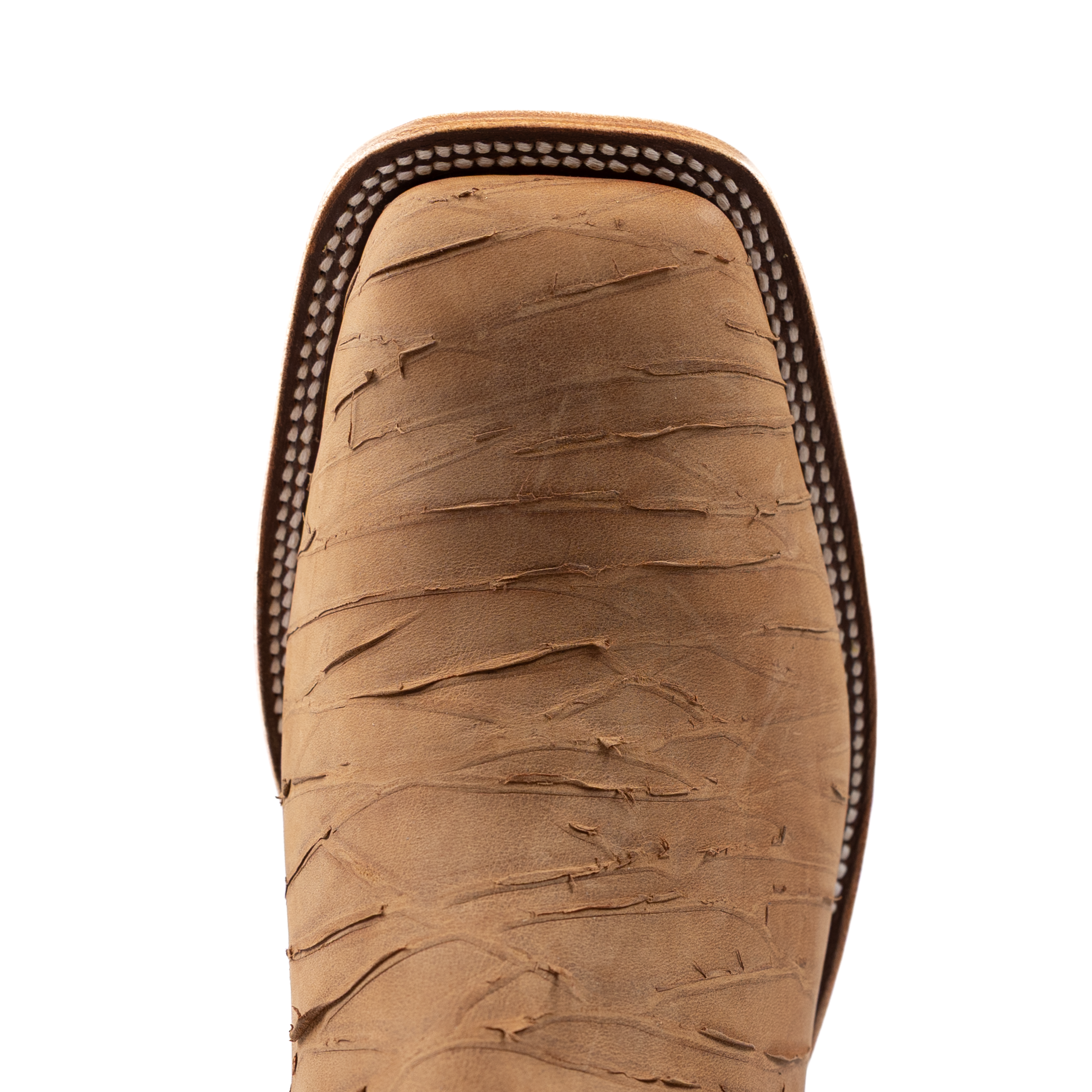 Close-up of a brown leather boot sole on a white background