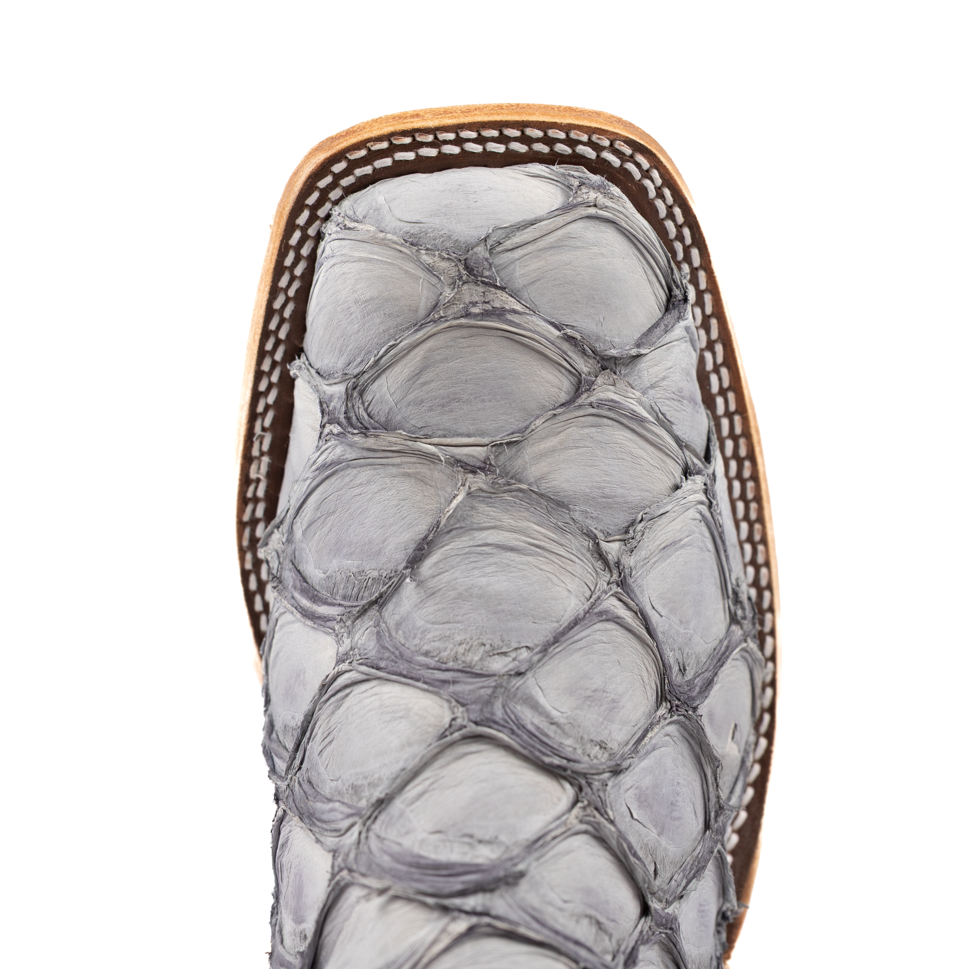 Close-up of a sandal with snake skin pattern on a white background
